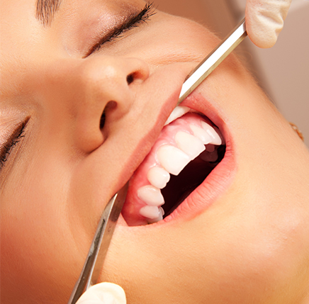 Woman under sedation with dental review